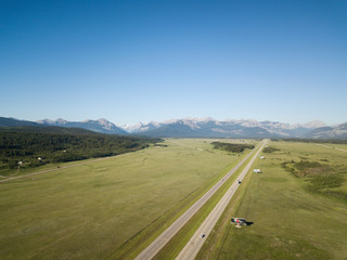 Aerial view of Trans-Canada Highway during a vibrant sunny summer day. Taken near Calgary, Alberta, Canada.
