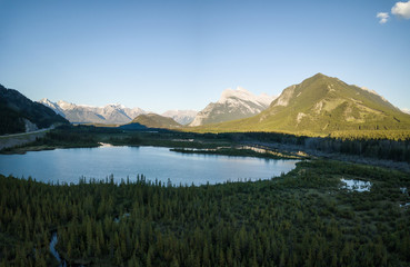 Aerial panoramic view of Vermilion Lakes during a vibrant summer sunset. Taken in Banff, Alberta, Canada.
