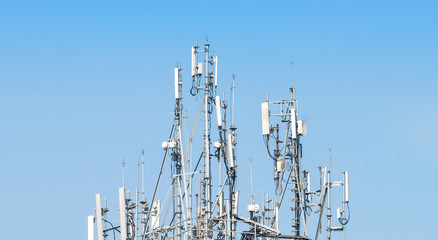 Several antennas at the top of a building