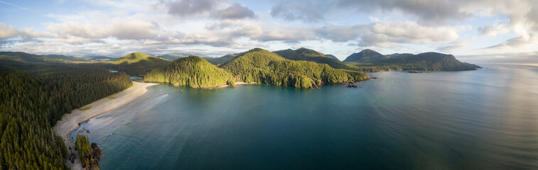 Striking aerial panoramic view of the Pacific Ocean Coast during a vibrant summer sunset. Taken in...