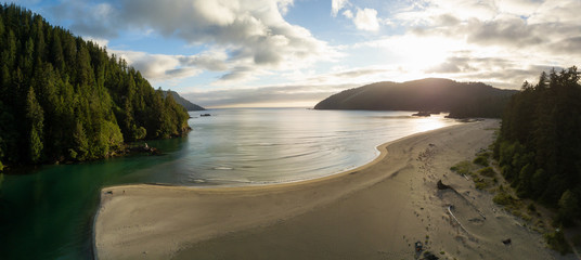 Striking aerial panoramic view of the Pacific Ocean Coast during a vibrant summer sunset. Taken in San Josef Bay, Cape Scott, Northern Vancouver Island, BC, Canada.