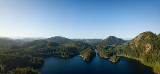 Aerial panoramic landscape view of Alice Lake during a vibrant sunny summer day. Located in Northern Vancouver Island, BC, Canada.