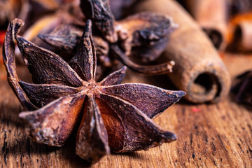 close up of star anise on wooden plank, slective focus