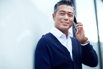 Mature business man make a phone call