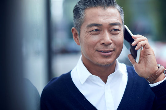 Mature business man make a phone call