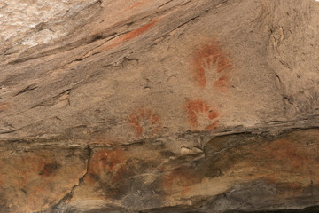 Ancient aboriginal stencil art of hands on a sandstone rock face in Blackdown Tableland National...