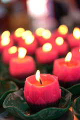 Flower candles burning at night.