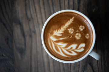 Top view latte art coffee cup.