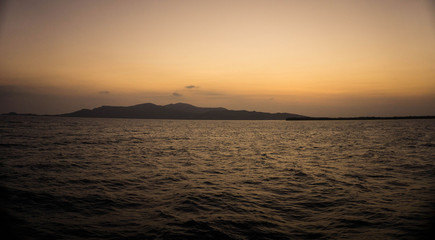 sunrise sky on the island see from far away sea in karimun jawa indonesia with golden color