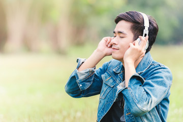 Asian young men listen to music