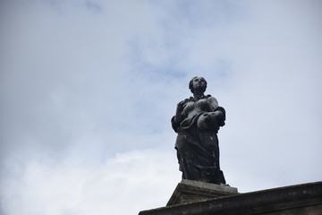 a statue eroded by wind and rain
