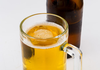 Mug with beer on white background