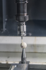 operator inspection automotive parts by CMM