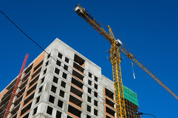 tower crane at the construction site of a residential building