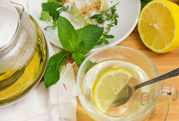 Top view of herbal tea in cup among of ingredients