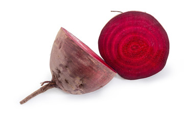 Uncooked red beetroot cut in half on a white background
