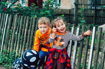 Funny kids with balloons on the street