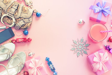 Christmas background pink Flat Lay fashion accessories handbag sandals phone gift box bow balls purple pink.