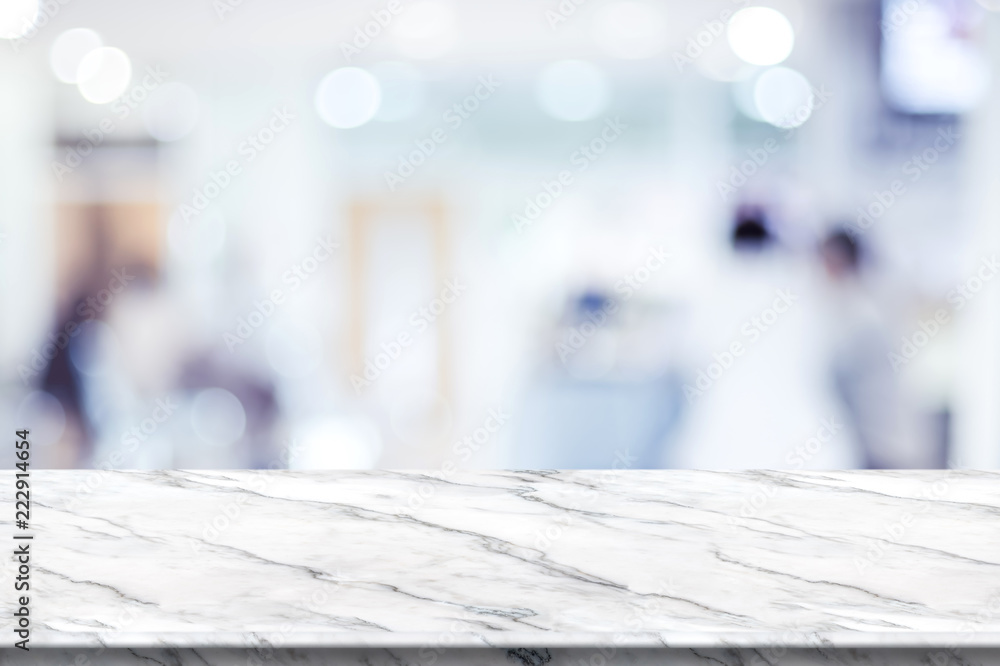 Poster empty white marble table top with blur patient waiting for doctor at hospital with bokeh light at ba