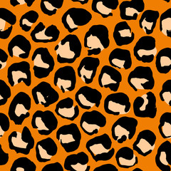 Vector illustration leopard print seamless pattern. Orange hand drawn background.