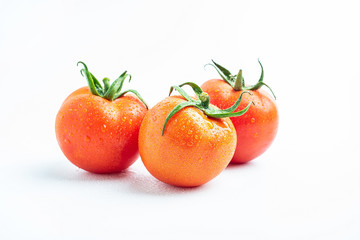 Fresh tomatoes on white background