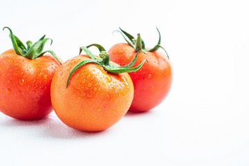 Fresh tomatoes on white background