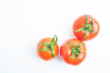 Fresh tomatoes on white background
