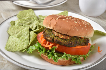 Veggie burger with guacamole tortilla chips