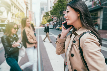 Fototapeta premium woman smiling and making phone call