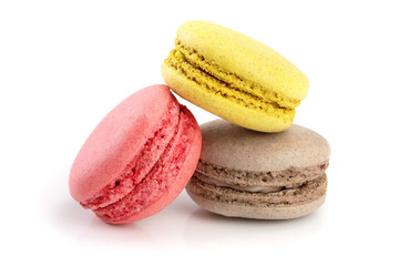 orange and chocolate macaroon isolated on white background closeup