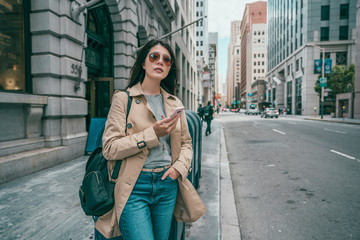 woman waiting and using phone while waiting