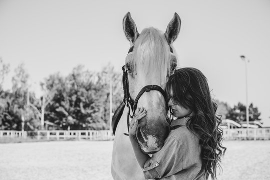 Young Pretty Woman Hugging Her Horse - Concept About Love Between People And Animals . Beautiful Lady Lifestyle With Best Friend Horse In Countryside. Portrait Of Human And Animals For Pet Life 