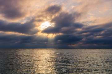 Sunset on the sea beach with stones