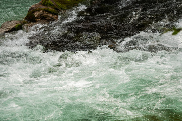 Obraz premium A river of clear water flows fast