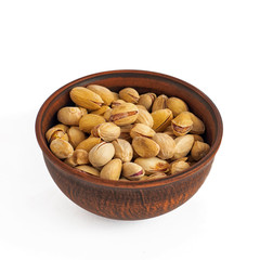 Bowl of pistachios on a white background
