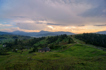 Fototapeta na wymiar Sunset against the backdrop of mountains and wildlife. Nature, travel, tourism