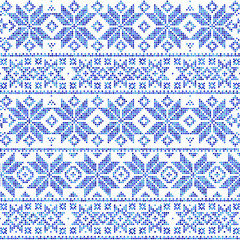 Abstract winter seamless pattern on a white  background. Geometric decor of colorful dots.
