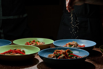 Asian food served on black stone, top view. Chinese and vietnamese cuisine set.
