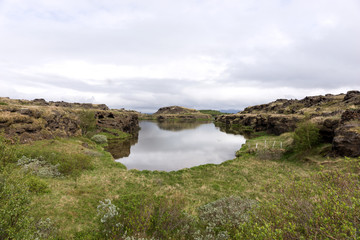View of Lake Myvatn with various volcanic rock formations in Iceland