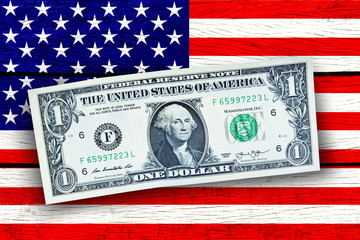5 September 2018 Bangkok Thailand people prepare US dollar money on Flag of USA design on wooden background in concept International Trade