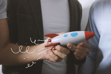 Businessman launches his startup company with a rocket