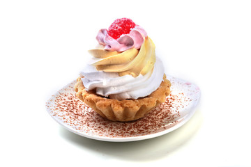 Tasty Homemade cupcake, muffin with cream and raspberry. Close up view delicious sweet dessert isolated on white.