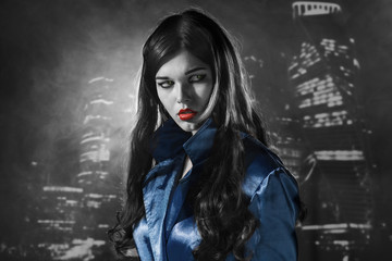 woman in a blue coat with red lips black and white in the city of sins