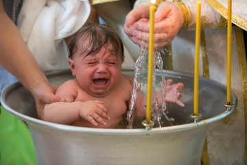 Baptism of a child. Ablution in holy water. Accepting faith. Orthodox baptism