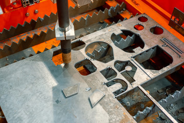 Plasma cutting machine cuts steel sheet.