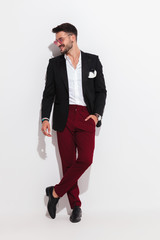 attractive smart casual man looks to side and smiles