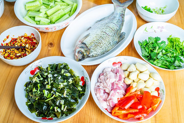Fresh vegetables and meat on a table