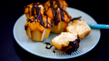 Muffins Glaze Chocolate on a black chalk background. Baking, Sweet Dessert.Top View.Copy space for Text.selective focus.