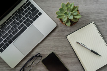 Flat lay laptop grey background