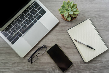 Flat lay laptop grey background